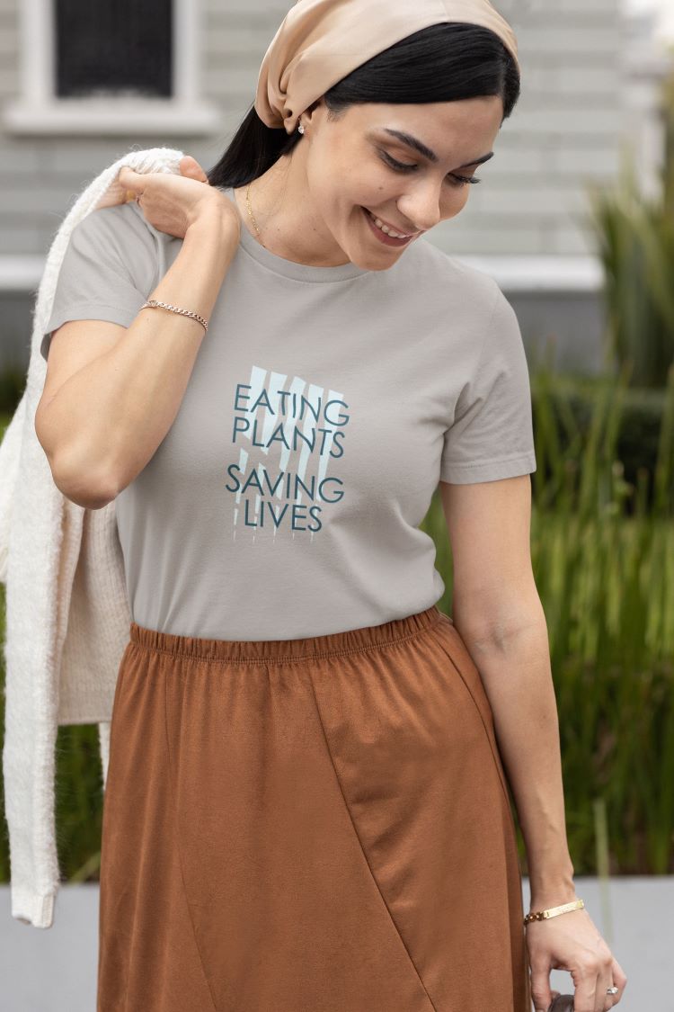 Cotton tee with 'Eating Plants, Saving Lives' slogan and animal prints