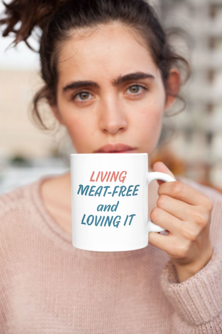 Glossy mug with 'Living Meat-Free and Loving It' slogan