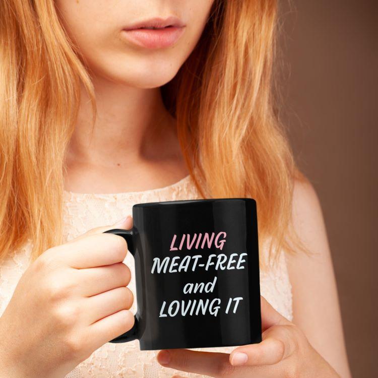 Glossy mug with 'Living Meat-Free and Loving It' slogan print