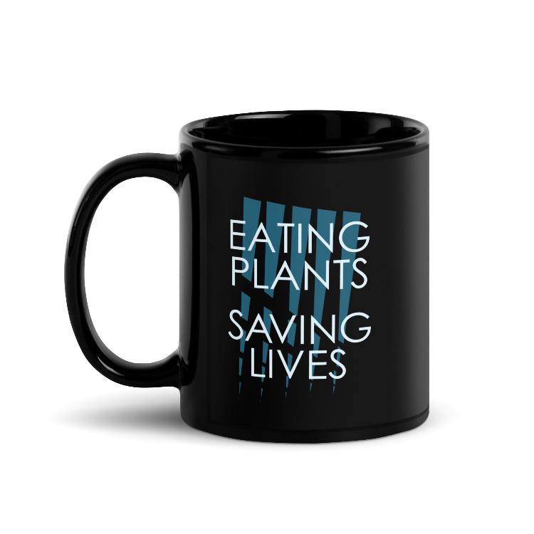 Glossy mug with "Eating Plants, Saving Lives" slogan