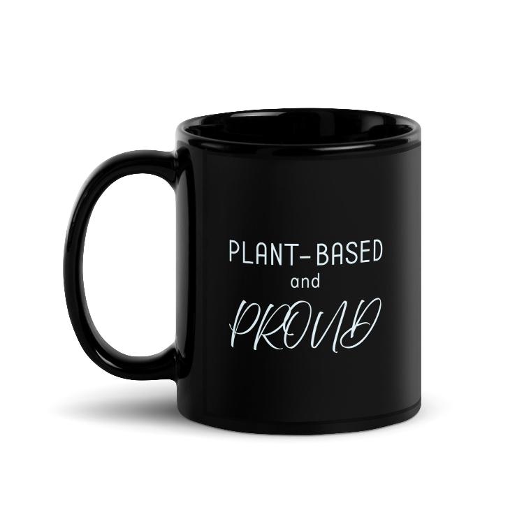 Glossy mug with 'Plant-Based and Proud' slogan promoting a meat-free lifestyle