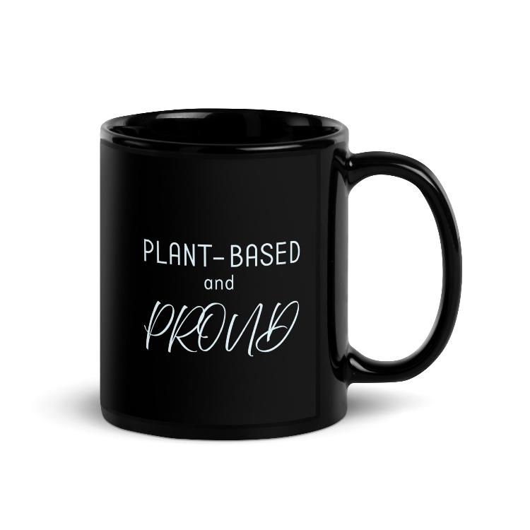 Glossy mug with 'Plant-Based and Proud' slogan promoting a meat-free lifestyle