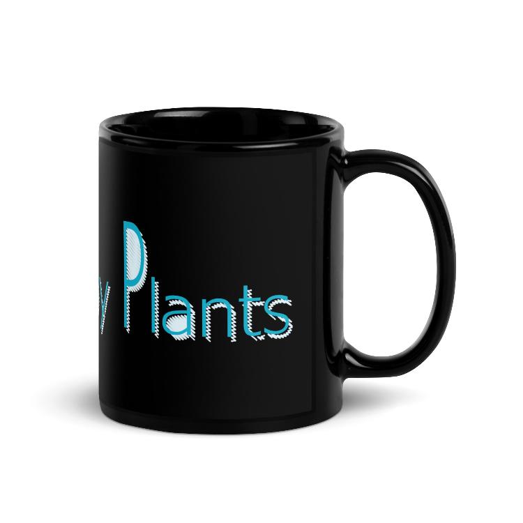 Glossy mug with "Powered by Plants" slogan for promoting a plant-based lifestyle