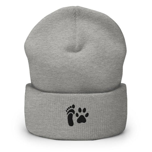 Cuffed beanie featuring human foot and animal paw embroidery for unity