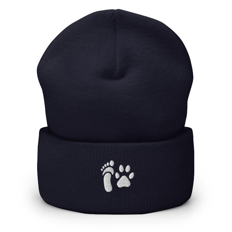 Cuffed beanie with human foot and animal paw embroidery symbolizing unity