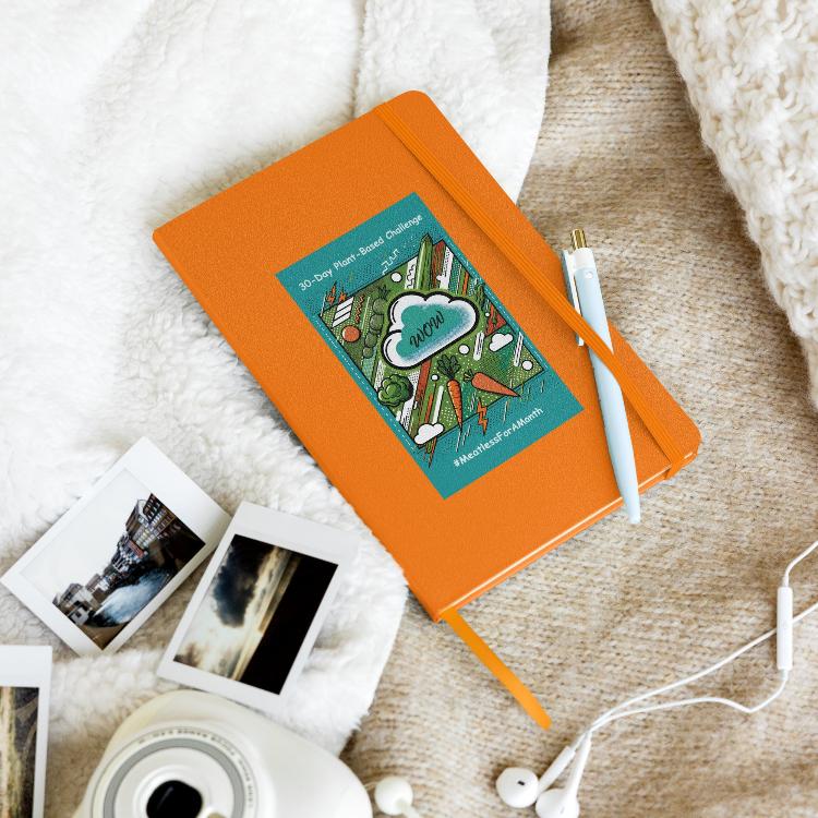 Eco-friendly notebook, vibrant pop art design, bright green, turquoise, orange vegetables, 30-Day Plant-Based Challenge, sustainable living, animal rights, cream-colored lined pages, elastic closure, ribbon marker