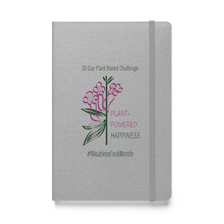 Vegetizer Hardcover Notebook with 'Plant-Powered Happiness' message, 80 lined cream-colored pages, elastic closure, ribbon marker, expandable inner pocket, eco-friendly design, promoting plant-based lifestyle