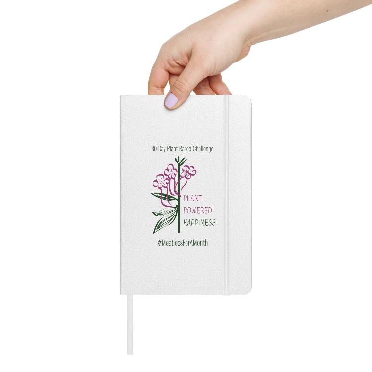 Vegetizer Hardcover Notebook with 'Plant-Powered Happiness' message, 80 lined cream-colored pages, elastic closure, ribbon marker, expandable inner pocket, eco-friendly design, promoting plant-based lifestyle