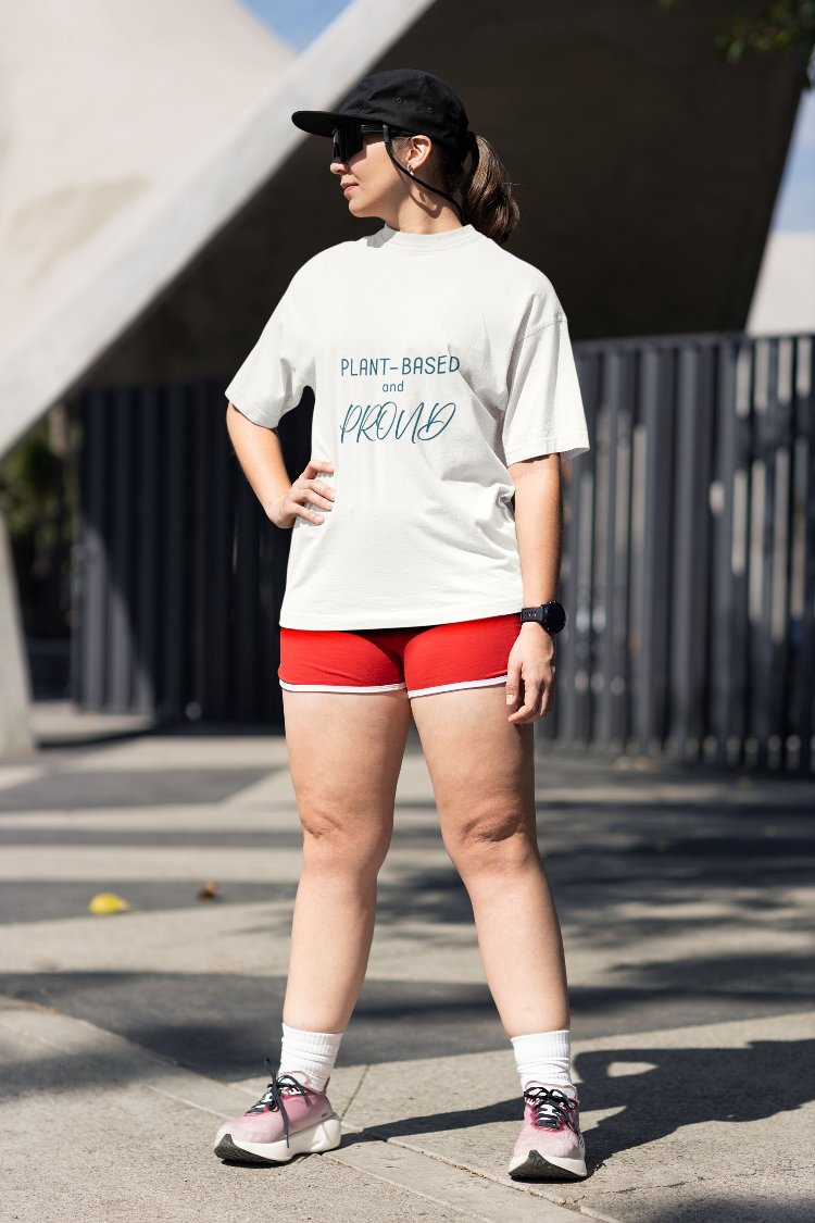 Unisex cotton tee with 'Plant-Based and Proud' slogan and animal prints