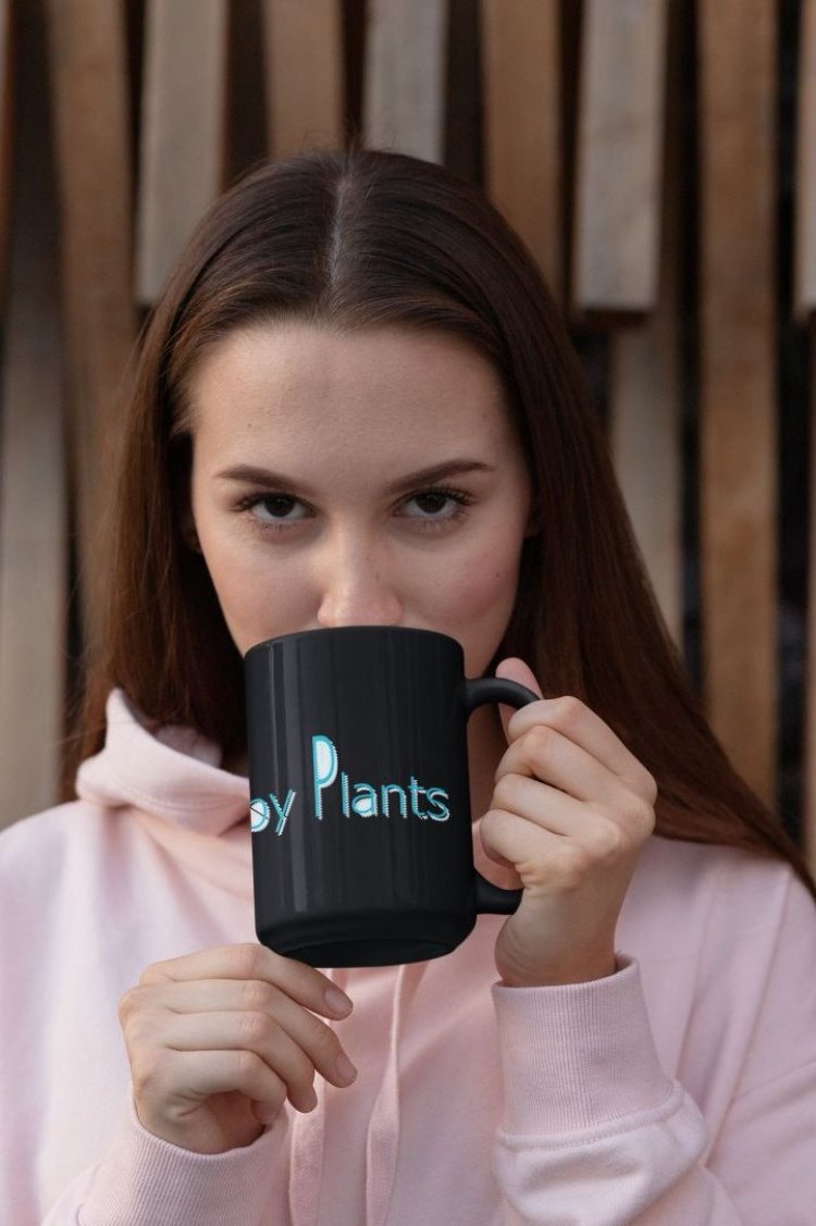 Glossy mug with "Powered by Plants" slogan for promoting a plant-based lifestyle