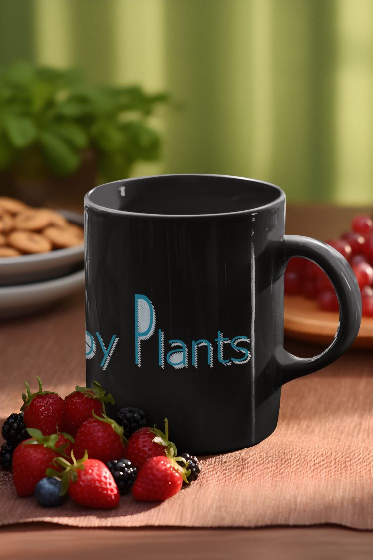 Glossy mug with "Powered by Plants" slogan for promoting a plant-based lifestyle