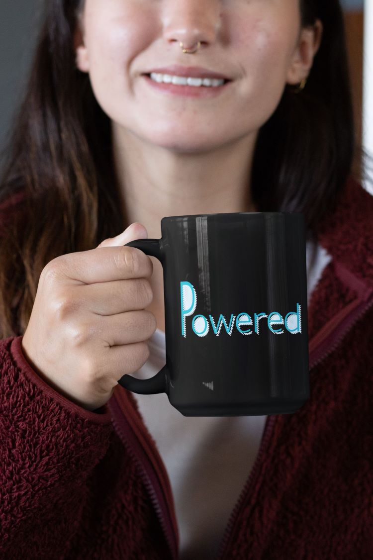 Glossy mug with "Powered by Plants" slogan for promoting a plant-based lifestyle