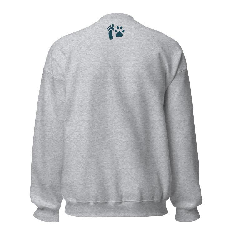 Comfortable plant-based sweatshirt with the slogan 'Living Meat-Free and Loving It'. Features human foot and animal paw prints symbolizing harmony. Ideal for promoting a plant-based lifestyle and animal welfare awareness