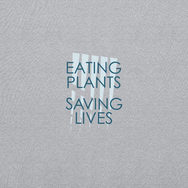 Cozy plant-based sweatshirt featuring the slogan 'Eating Plants, Saving Lives' on the front, with human foot and animal paw prints on the label, promoting the 30-Day Plant-Based Challenge and raising awareness for animal welfare