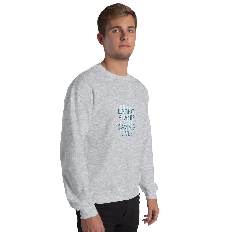 Cozy plant-based sweatshirt featuring the slogan 'Eating Plants, Saving Lives' on the front, with human foot and animal paw prints on the label, promoting the 30-Day Plant-Based Challenge and raising awareness for animal welfare