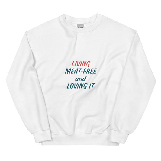 Comfortable plant-based sweatshirt with the slogan 'Living Meat-Free and Loving It'. Features human foot and animal paw prints symbolizing harmony. Ideal for promoting a plant-based lifestyle and animal welfare awareness