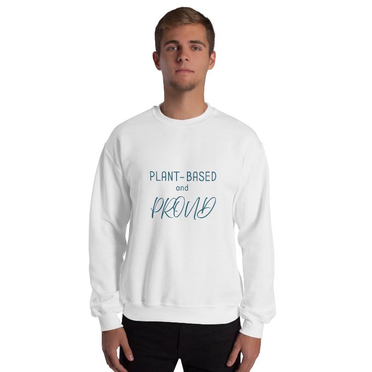 Cozy sweatshirt featuring the slogan "Plant-Based and Proud" on the front, with a human foot and animal paw print on the outside label, symbolizing harmony between humans and animals. Made from a blend of 50% cotton and 50% polyester, this pre-shrunk classic fit sweatshirt is ideal for colder months, promoting a plant-based lifestyle and raising awareness for animal welfare