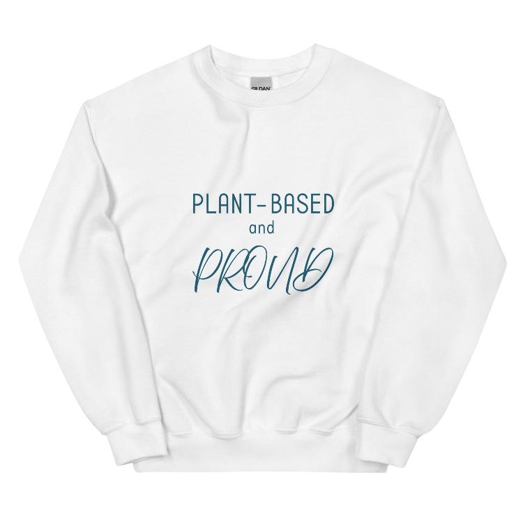 Cozy sweatshirt featuring the slogan "Plant-Based and Proud" on the front, with a human foot and animal paw print on the outside label, symbolizing harmony between humans and animals. Made from a blend of 50% cotton and 50% polyester, this pre-shrunk classic fit sweatshirt is ideal for colder months, promoting a plant-based lifestyle and raising awareness for animal welfare