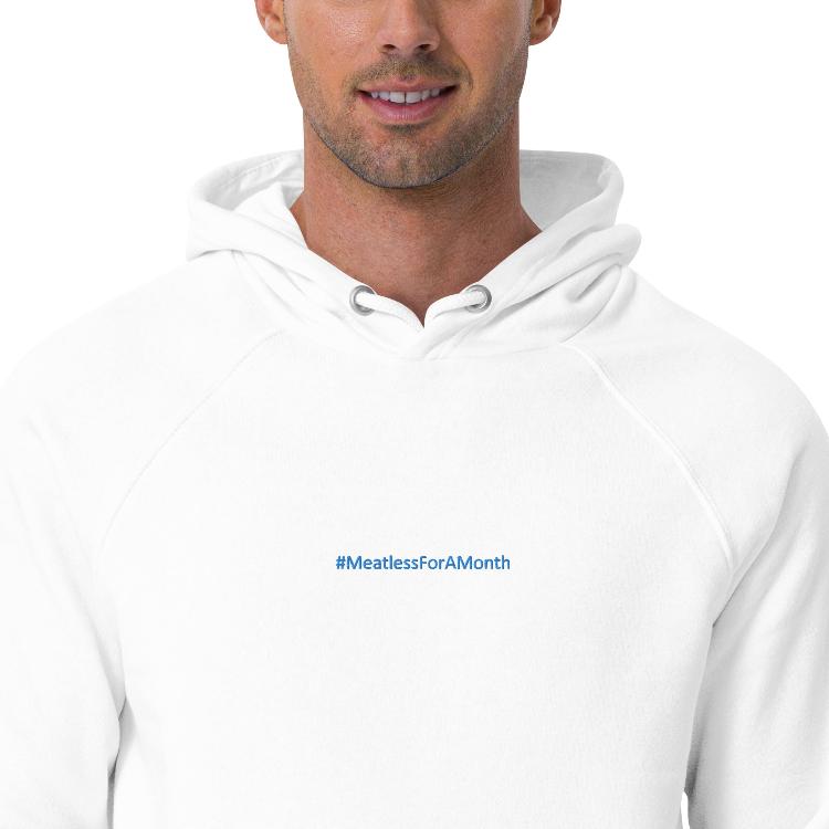 Sustainable unisex raglan hoodie with #MeatlessForAMonth print, promoting plant-based living