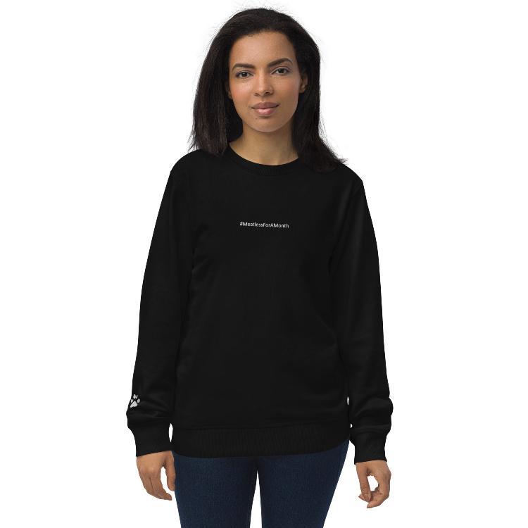 Organic unisex sweatshirt with #MeatlessForAMonth chest embroidery, human foot and animal paw design on right wrist, eco-friendly, made from organic cotton and recycled polyester, promotes plant-based lifestyle, animal rights, and sustainability