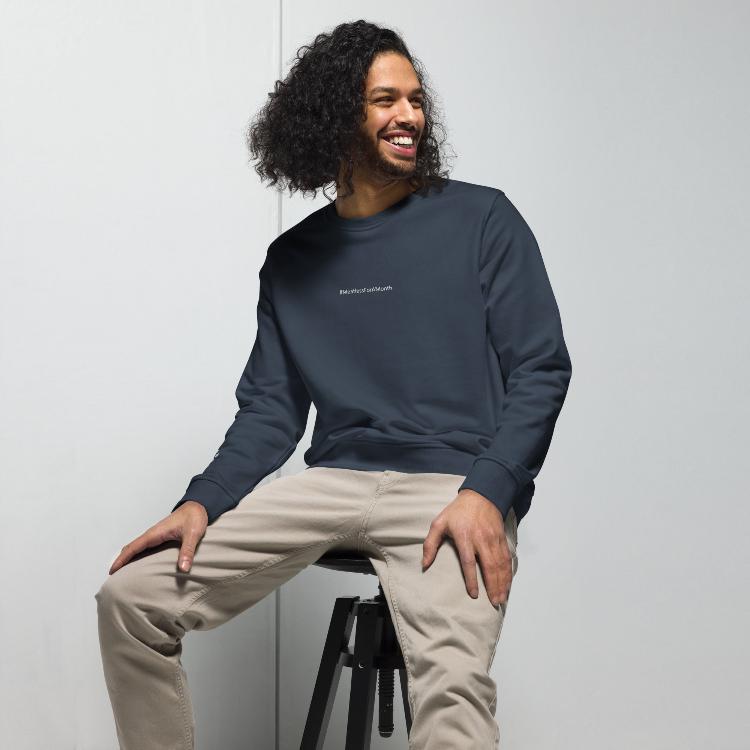 Organic unisex sweatshirt with #MeatlessForAMonth chest embroidery, human foot and animal paw design on right wrist, eco-friendly, made from organic cotton and recycled polyester, promotes plant-based lifestyle, animal rights, and sustainability