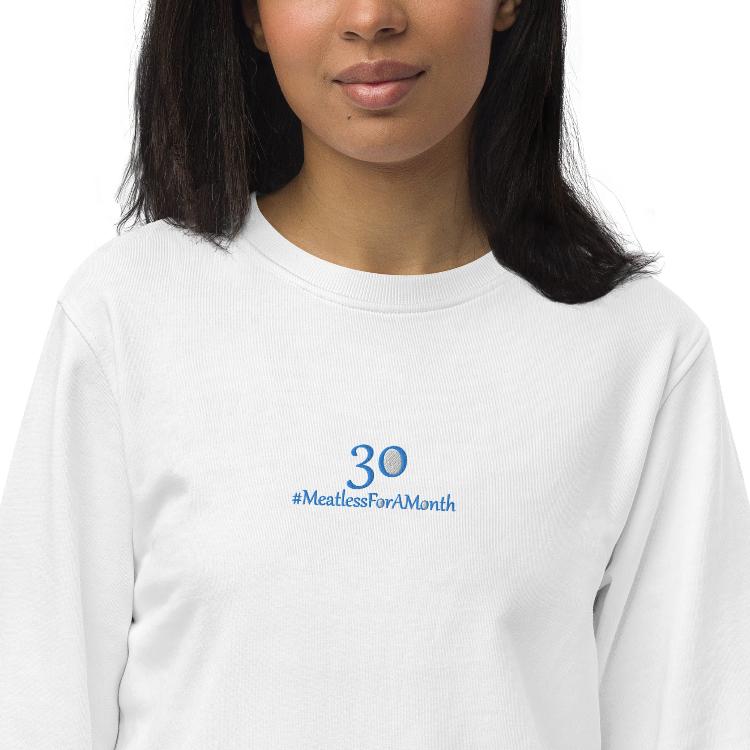 Organic unisex sweatshirt with #MeatlessForAMonth embroidery, human foot and animal paw design, eco-friendly, soft, plant-based lifestyle, sustainable fashion, animal rights advocacy