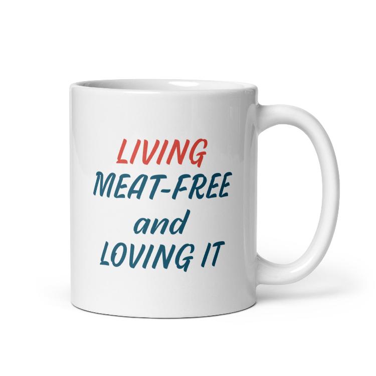 Glossy mug with 'Living Meat-Free and Loving It' slogan