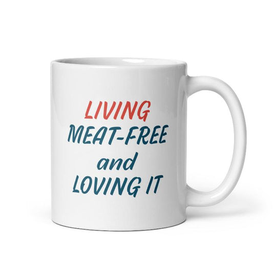 Glossy mug with 'Living Meat-Free and Loving It' slogan