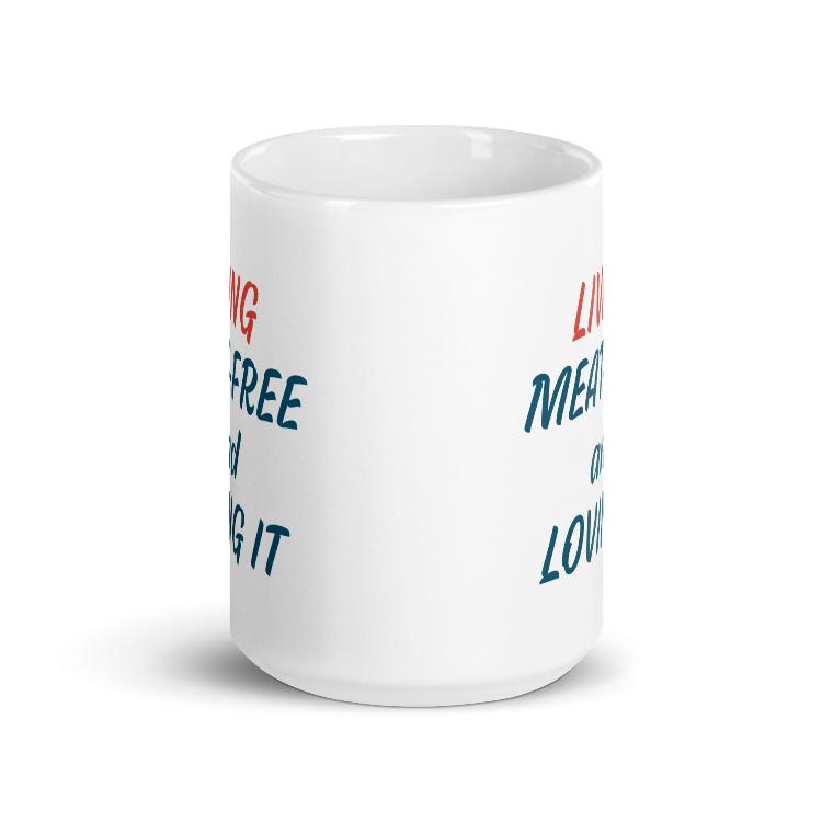 Glossy mug with 'Living Meat-Free and Loving It' slogan