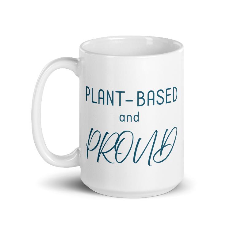 Glossy mug with 'Plant-Based and Proud' slogan promoting a meat-free lifestyle