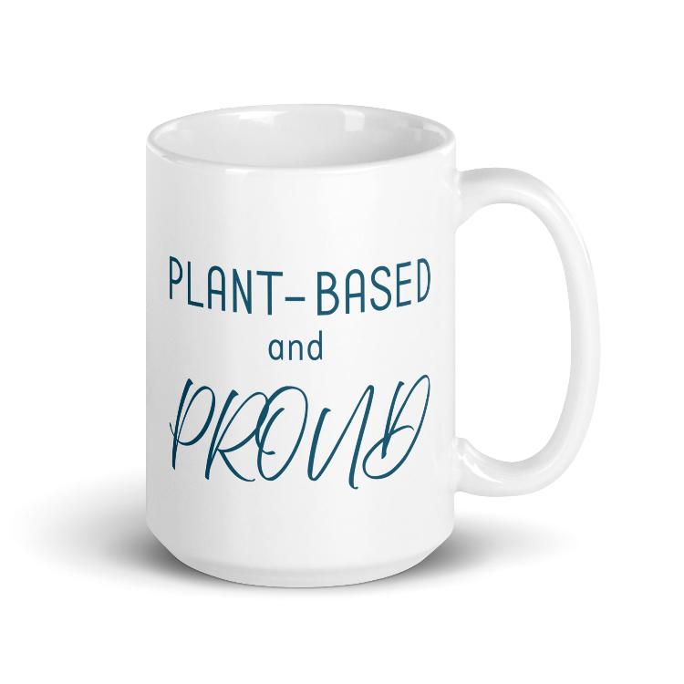 Glossy mug with 'Plant-Based and Proud' slogan promoting a meat-free lifestyle